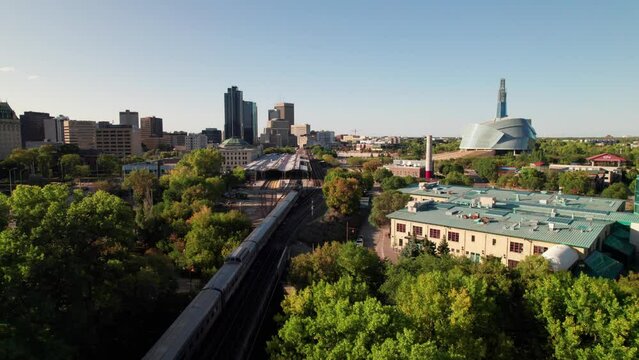 Cinematic aerial of Via Rail train entering Winnipeg, MB, 4K