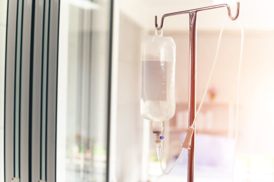 Saline solution vitamin iv fluid intravenous drip droper with medicine for patient and infusion pump in hospital hospitel concept treatment emergency and injection drug infusion care chemotherapy