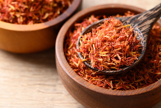 Dried safflower in spoon and bowl, Herbal tea
