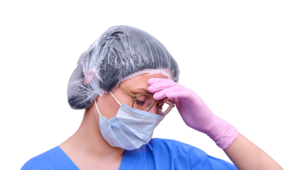 Woman doctor in a medical mask on a tiredly holds on to a sore head, isolated on a white background. Medic in despair, concept of the coronavirus epidemic.