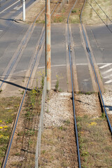 Top view of streetcar tracks and street, intersection.