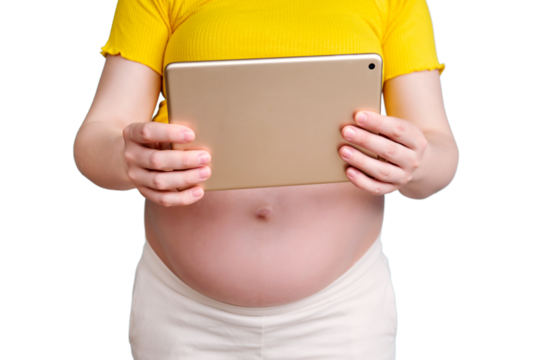 A pregnant woman holds a tablet in her hand for shooting videos and photos, isolated on a white background
