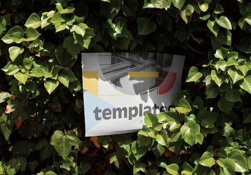 Mockup of customizable A2 horizontal poster in hedge
