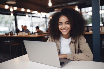Portrait of Beautiful Black Female Student Learning Online in Coffee Shop, Young African American Woman Studies with Laptop in Cafe, Doing Homework - obrazy, fototapety, plakaty