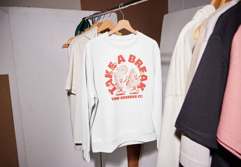 Mockup of customizable color sweatshirt hanging on railing, hard light - obrazy, fototapety, plakaty