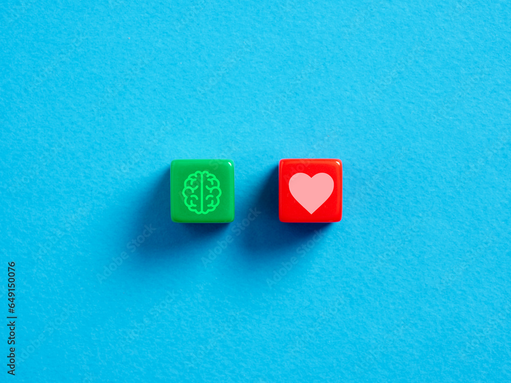 Poster logic or emotion. thinking and decision making. heart and brain symbols on colorful cubes on blue ba