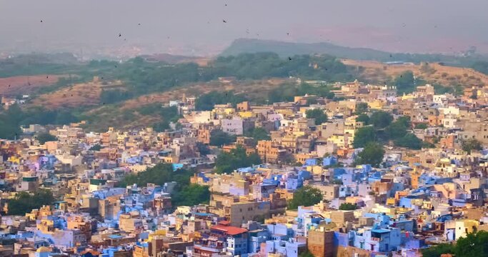 Houses and roofs of famous tourist landmark Jodhpur, the Blue City, aerial view from Mehrangarh Fort, Rajasthan, India. Camera panning