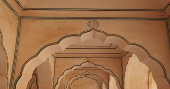 Corridor, wall and arch inside Sheesh Mahal in Amer (Amber) Palace complex. Amer, Rajasthan, India. Zoom in