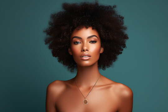 Black woman afro, portrait and confident face in beauty and style against a studio background, Beautiful isolated African American female proud model with necklace, jewelry and hairstyle for fashion