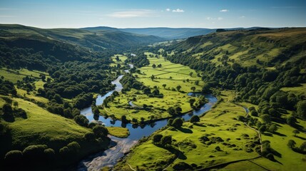 Fototapeta na wymiar Aerial view of village with river, peak district national park and green fields