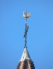 Weather vane on top of an old church tower