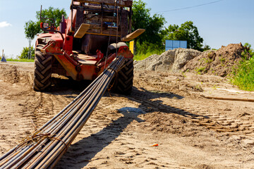 Forklift lifts the rebar bundle from ground on building site