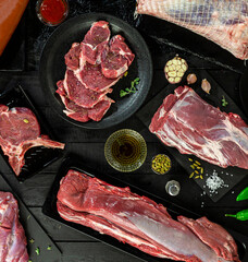 Collection of fresh tender beef on black background, shank meat, flank meat, rib meat ,chuck meat, round meat from top view  11