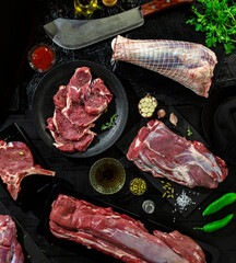 Collection of fresh tender beef on black background, shank meat, flank meat, rib meat ,chuck meat, round meat from top view 8