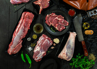 Collection of fresh tender beef on black background, shank meat, flank meat, rib meat ,chuck meat, round meat from top view 7