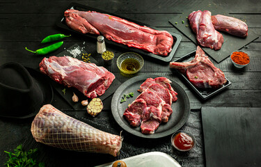 Collection of fresh tender beef on black background, shank meat, flank meat, rib meat ,chuck meat, round meat.