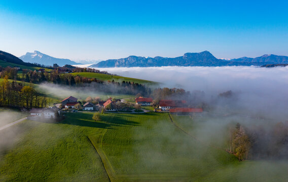 Austria, Upper Austria, Drone View Of Thick Fog Behind Small Village