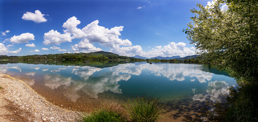 Austria, Upper Austria, Zell am Moos, Drone panorama of summer clouds reflecting in Irrsee lake