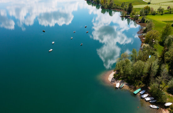 Austria, Upper Austria, Zell am Moos, Drone view of summer clouds reflecting in Irrsee lake