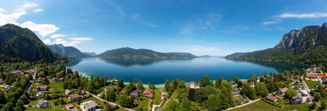 Austria, Upper Austria, Weissenbach am Attersee, Drone panorama of Lake Atter and surrounding village in summer