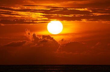 Amazing big sun in sunset sky, Majestic sunset clouds sky landscape,Amazing light of nature cloudscape sunset or sunrise sky over sea landscape background
