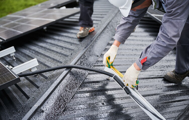 Competent worker making measurements for exact calculations. Measurements for installation solar...