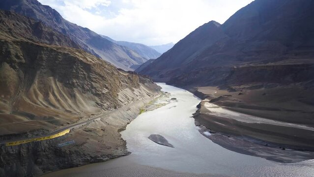 Indus and Zanskar river confluence or sangam flowing through Himalayan Mountain Valley in Ladakh India