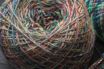 Closeup of  handspun ball of sheep wool yarn, spun on a traditional spinning wheel as a craft hobby