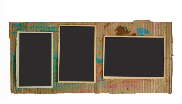 old empty photo frames, vintage photo prints, flat lay on grungy cardboard, free pics space,isolated on transparent backaground