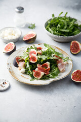 Arugula salad with figs and mozzarella cheese