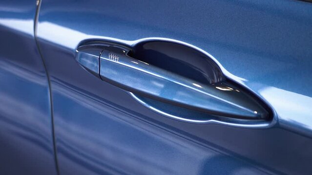 Kyiv, Ukraine - APRIL 12, 2023: Blue BMW X1 car door handle