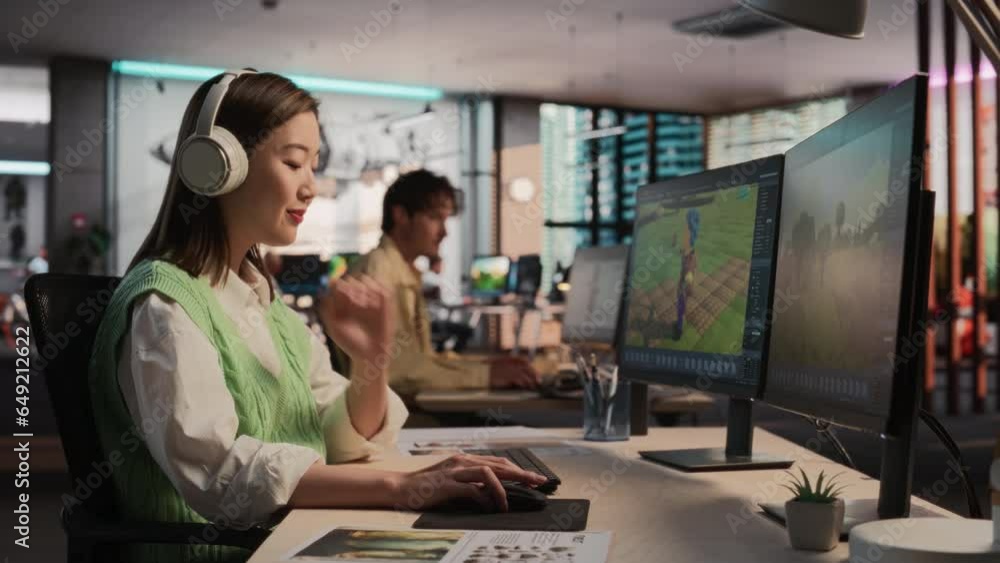 Poster Asian Female Game Developer Using Desktop Computer, Designing Unique World And Characters In 3D modelling Software For Survival Video Game. Creative Woman Working In Diverse Game Design Studio Office.