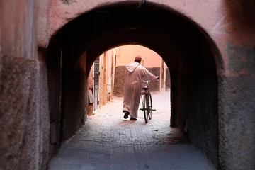Zelfklevend Fotobehang Man with bike in Marrakesh medina (old city), Morocco. © Julian