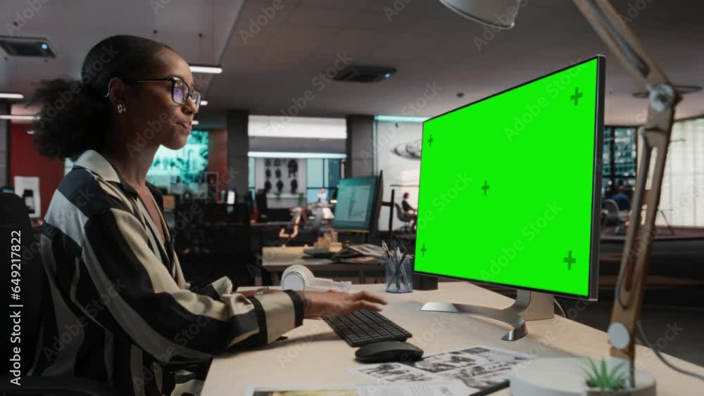 Poster creative black woman using desktop computer with mock-up green screen chromakey. female concept arti