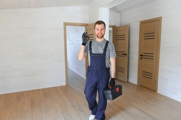 A worker installs windows in a new modular home. The concept of a new home.