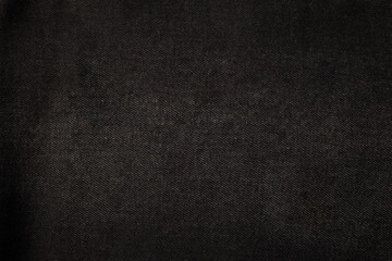 Texture of black denim. Denim background.