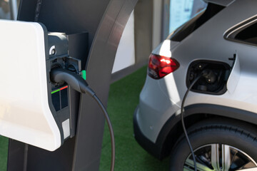 Close-up of an electric car with a cable