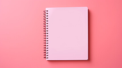 A notebooks on pink background.