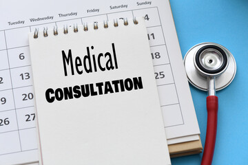 medical consultation words in notebook on calendar.