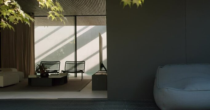 Modern vacation home with stylish interior and furniture, couch, coffee table and rattan chairs in living room, lounge bean bag armchair outside on terrace. Rest concept