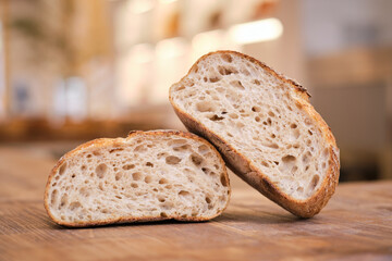 Still life photo of rustic bread on a wooden background with nat