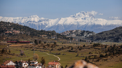 Beautiful view of the town of Ovindoli. Beautiful view of the Apennines. The road comes almost to...