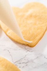 Heart-shaped sugar cookies with royal icing