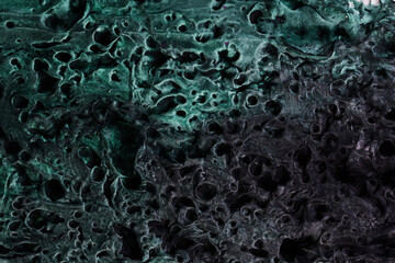 Decorative green putty background. Wall texture with filler paste applied with spatula, chaotic dashes and strokes over plaster. Creative design, stone pattern, cement.