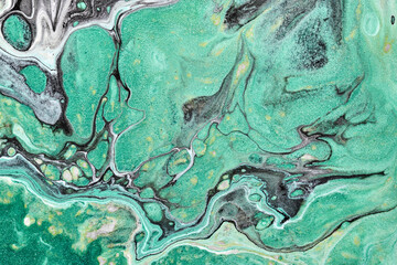 Abstract green black color background. Multicolored fluid art. Waves, splashes and blots acrylic alcohol ink, paints under water