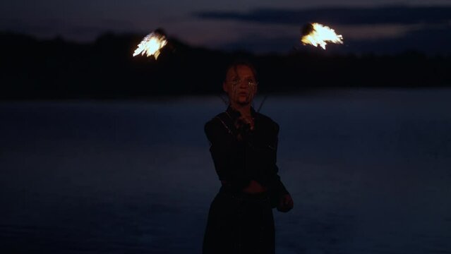 Portrait Of Woman Rotating Burning Torches In Darkness, Professional Stuntwoman Silhouette