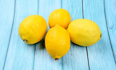 Group of fresh lemons on a wood table