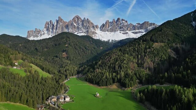 Spring landscape with shurch in Santa Magdalena village, Italian Dolomites Alps, in South Tyrol, Val di Funes, Italy, 4k