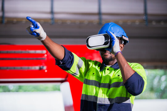 engineer man african american using virtual reality glasses. goggles innovation future watching education internet. Work is controlled through a modern digital system.