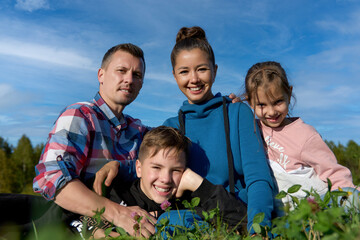 Happy young family spending time together, outdoors